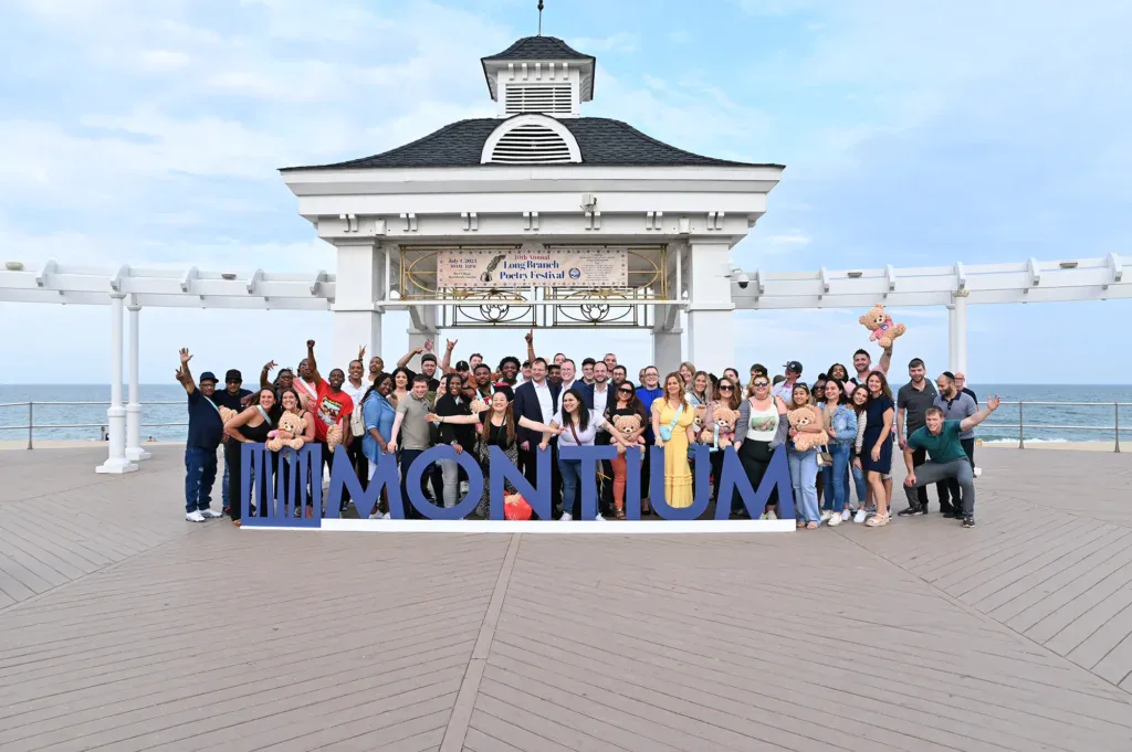 Montium Team photo on the boardwalk at the Jersey Shore.
