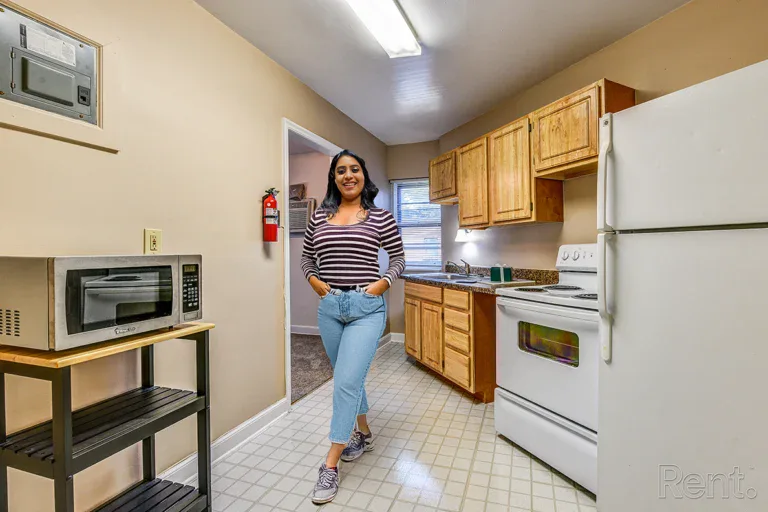 Tremont Apartments woman smiling in kitchen