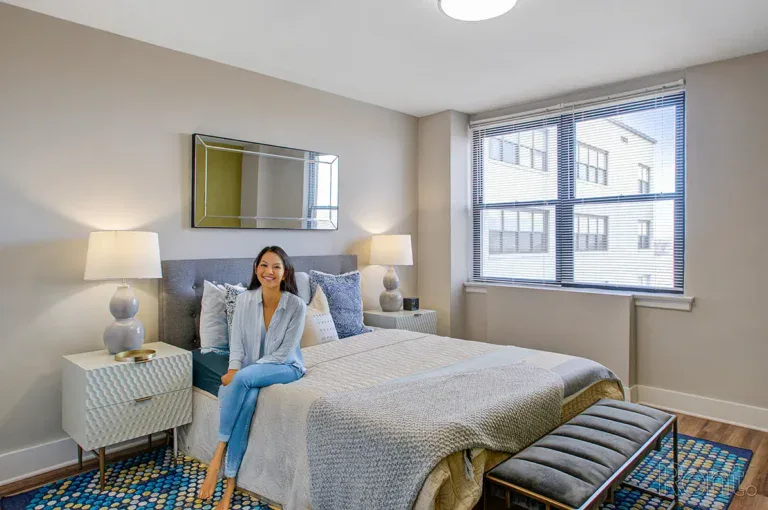 Smiling on Bed The Avenue at East Falls