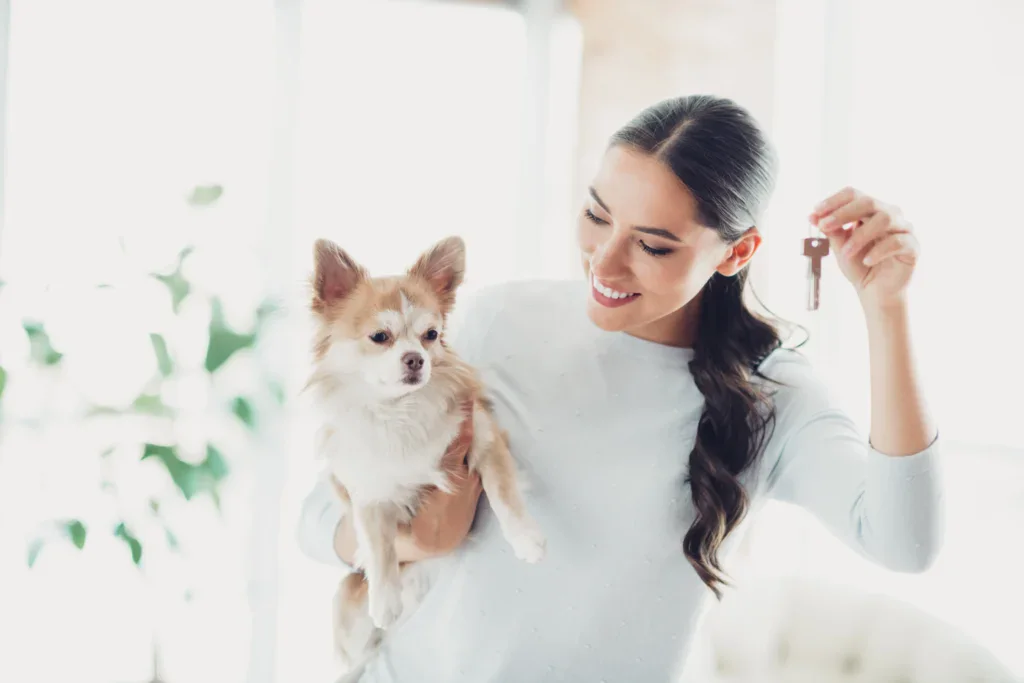 Woman Holding Dog and Keys