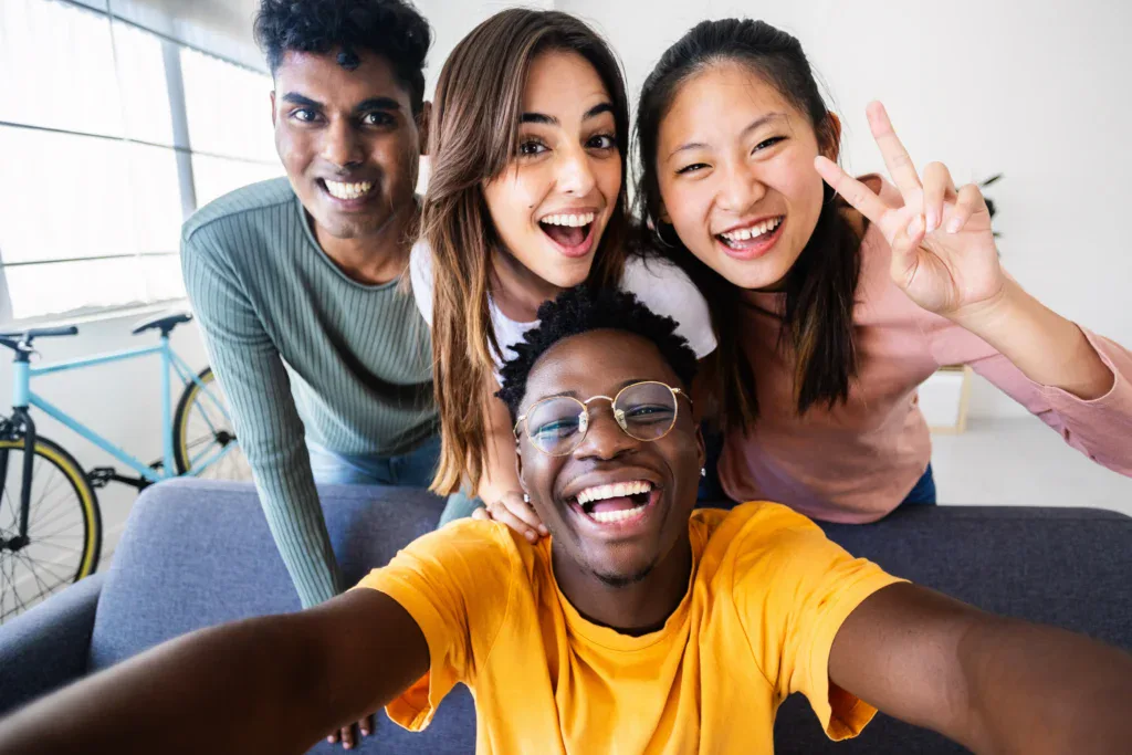 Friends in Apartment Smiling in a Selfie