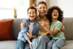 Family Smiling on Couch